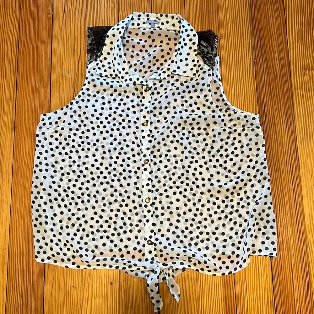 Sleeveless sheer button down top. Black and white polka dots.